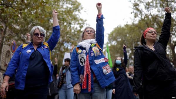 Protesters raise their fists during a demonstration rally organized by women's rights groups to defend the right to abortion, on International Safe Abortion Day in Paris, Sept. 28, 2024. 