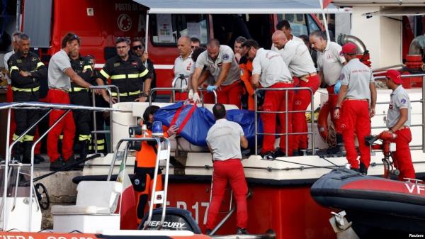 Rescue personnel transport a body bag after a luxury yacht, which was carrying British entrepreneur Mike Lynch, sank off the coast of Porticello, near the Sicilian city of Palermo, Italy, Aug. 21, 2024.