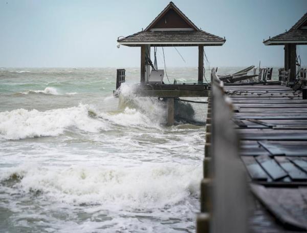 Waves crash onto Naples Pier in Naples, FL. ahead of Hurricane Helene on Sept. 26, 2024.