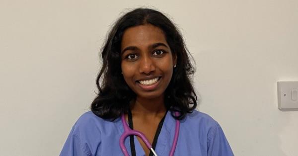 Tharanika Ahillan in scrubs