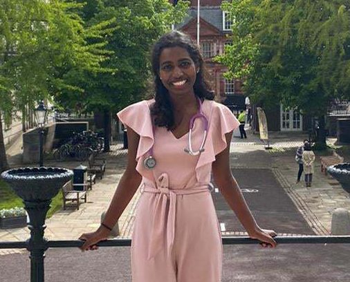 Tharanika Ahillan with a stethoscope around her neck