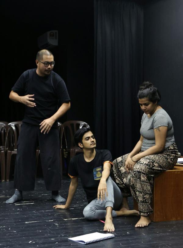 Kwok (left) directs the lead actors, Naveen (centre) and Deena, during a rehearsal for their upcoming play 'Son Of The Forest'. Photo: Azman Ghani/The Star 